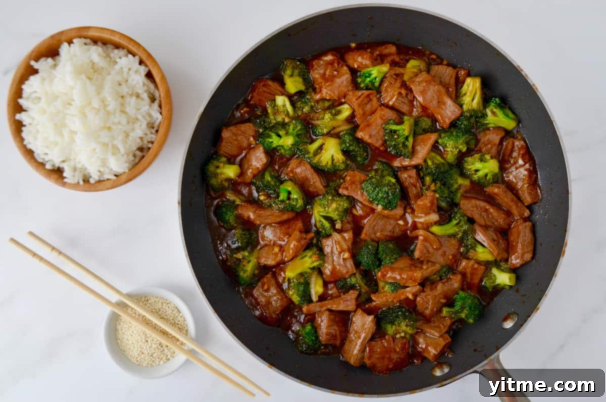 Delicious beef and broccoli stir-fry in a pan, ready to be served.