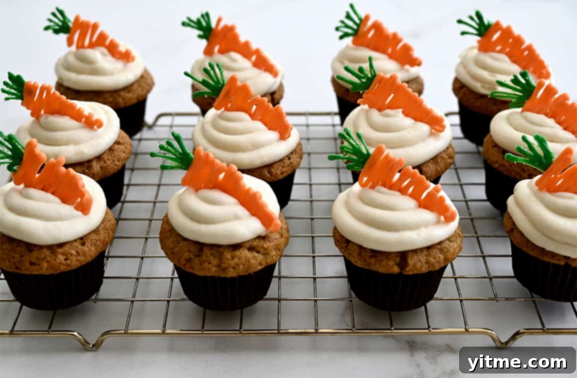 Carrot cupcakes on a cooling rack