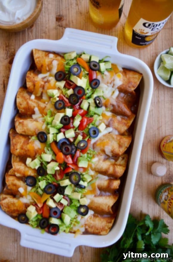 A white baking dish brimming with cheesy enchiladas, surrounded by refreshing beers, showcasing a perfect combination of comfort food and festive beverages for a delightful gathering.