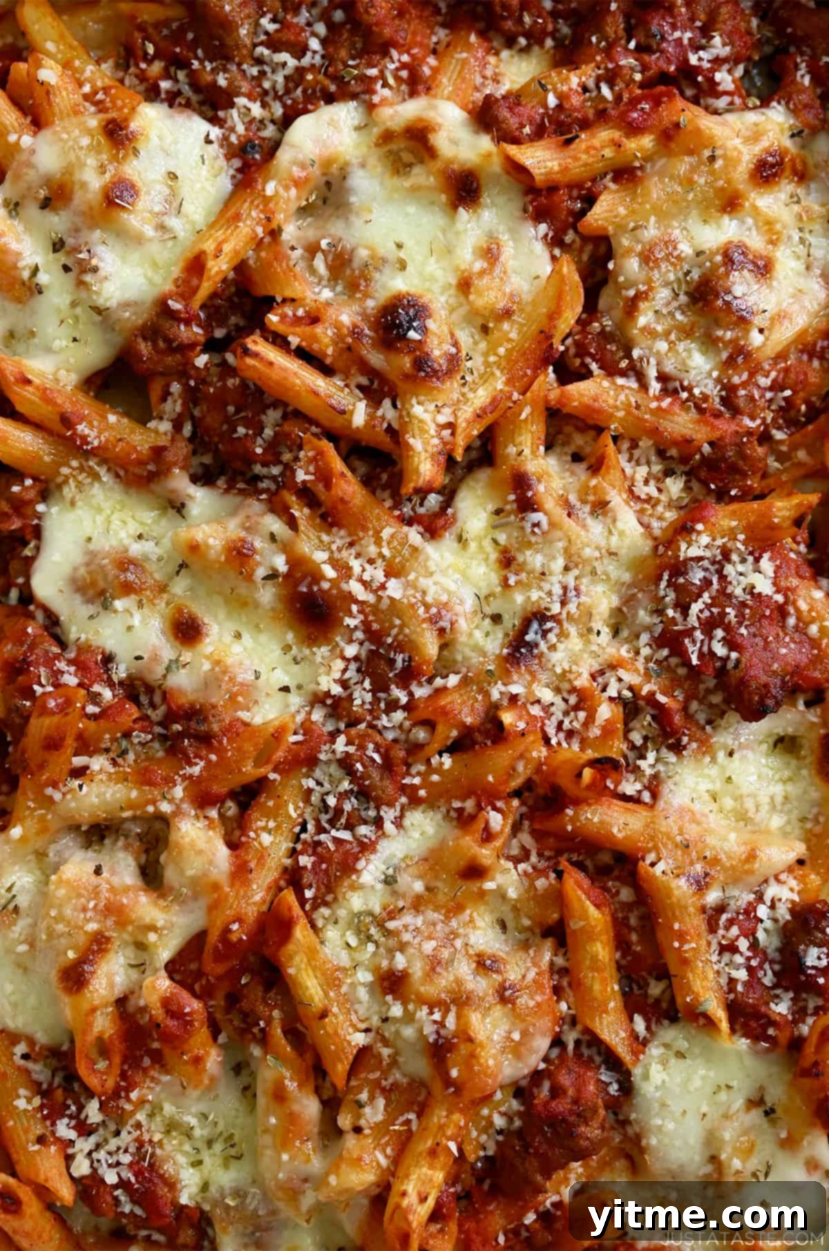 Baked penne pasta with golden brown mozzarella and freshly grated Parmesan cheese.