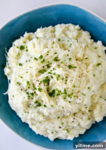 Mashed cauliflower with cheese and chives.