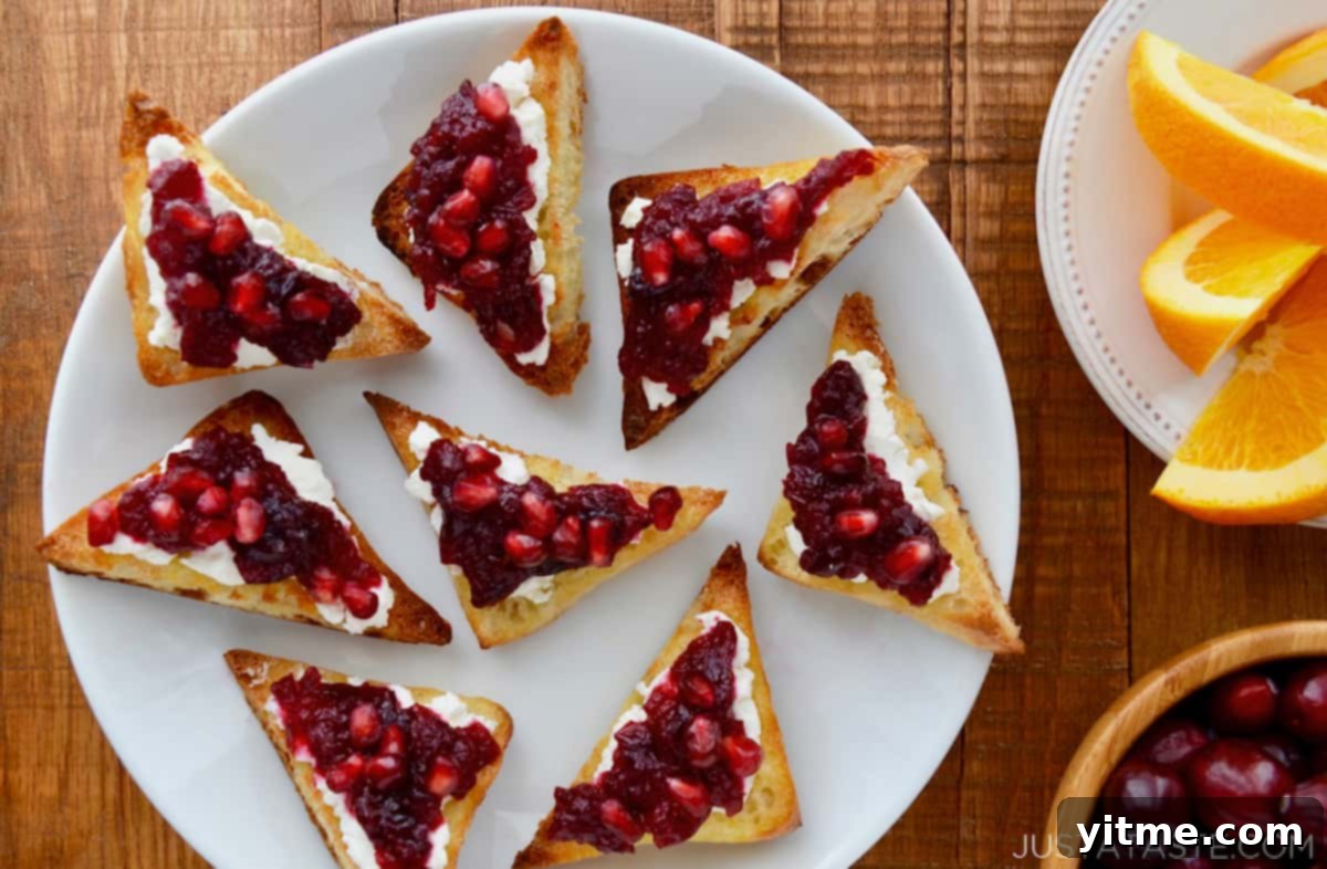 Toast topped with goat cheese and cranberry sauce.