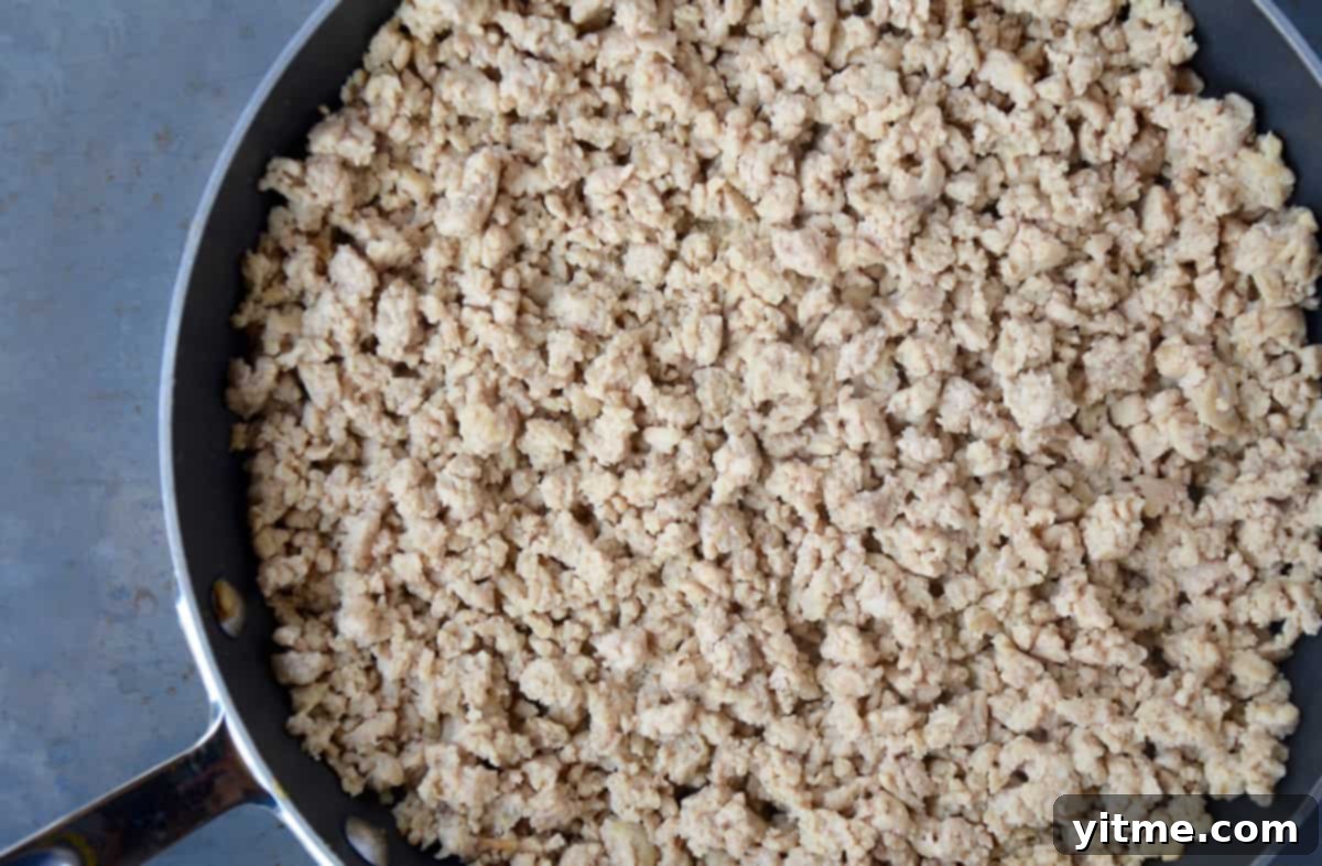 Cooked ground chicken in a skillet