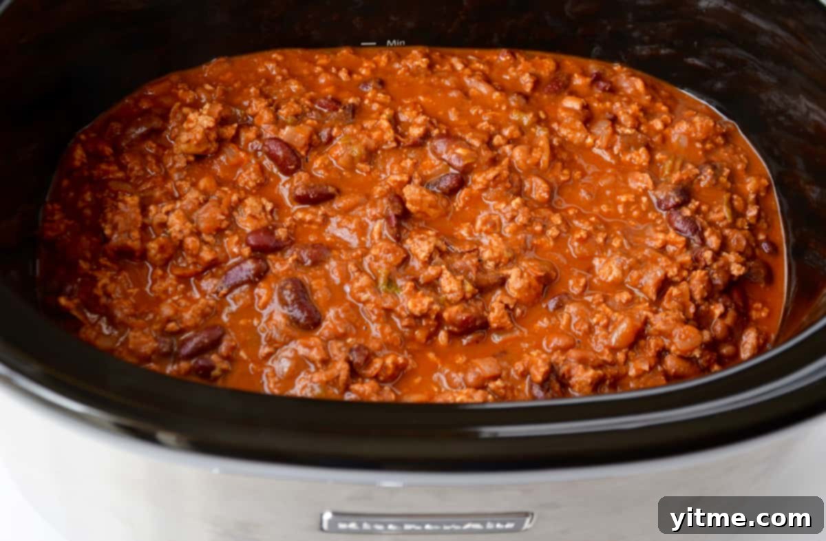Slow cooker chicken chili cooking
