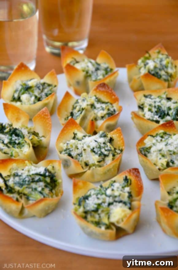Spinach-Artichoke Dip Wonton Cups on white plate