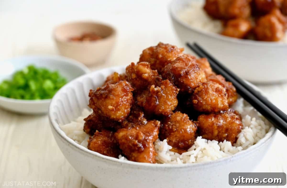 Orange chicken atop steamed rice