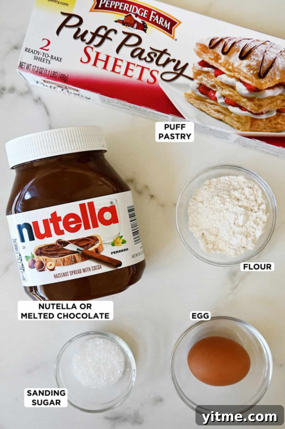 Decadent Chocolate Swirls 3 Ingredients for Chocolate Puff Pastry Twists: Nutella, puff pastry, egg, flour, sanding sugar.