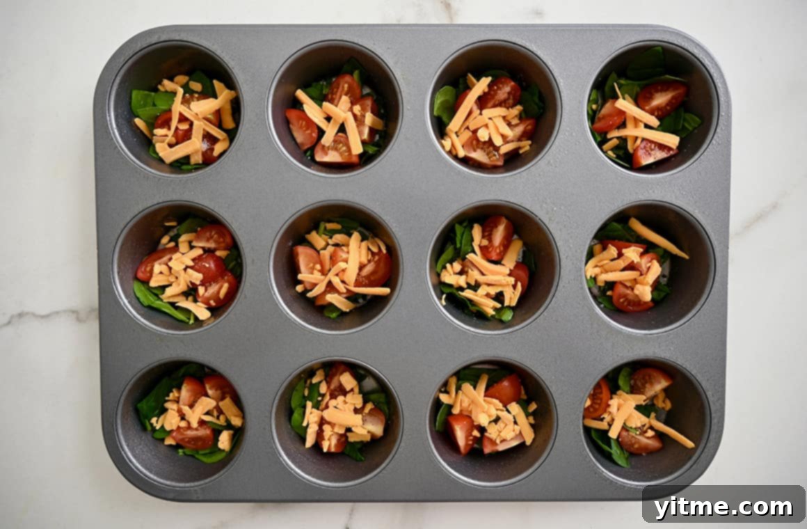 Muffin pan with veggies and cheese