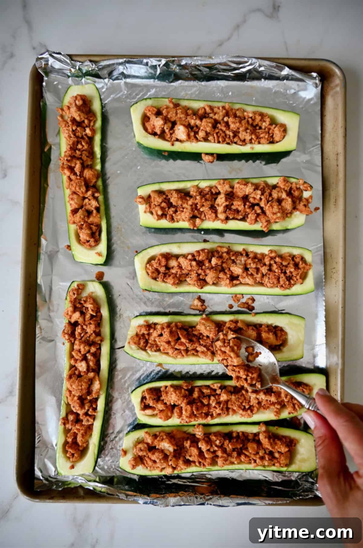 Deliciously Healthy Stuffed Zucchini Boats 6 Stuffing zucchini boats with a taco-seasoned ground meat filling.