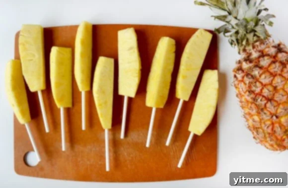 Delicious Chocolate Pineapple Sticks with White Chocolate Drizzle