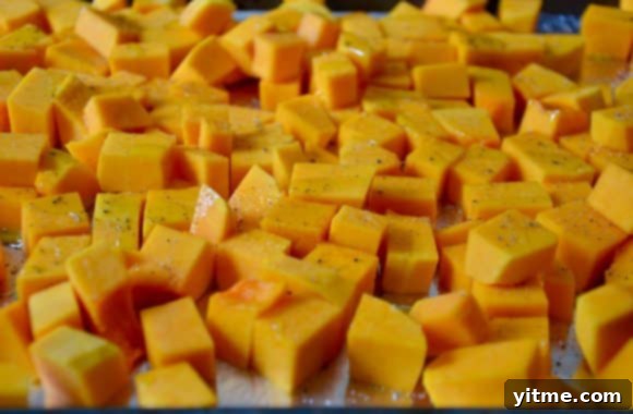 Golden Butternut Bites 4 Roasted butternut squash cubes on a baking sheet with foil