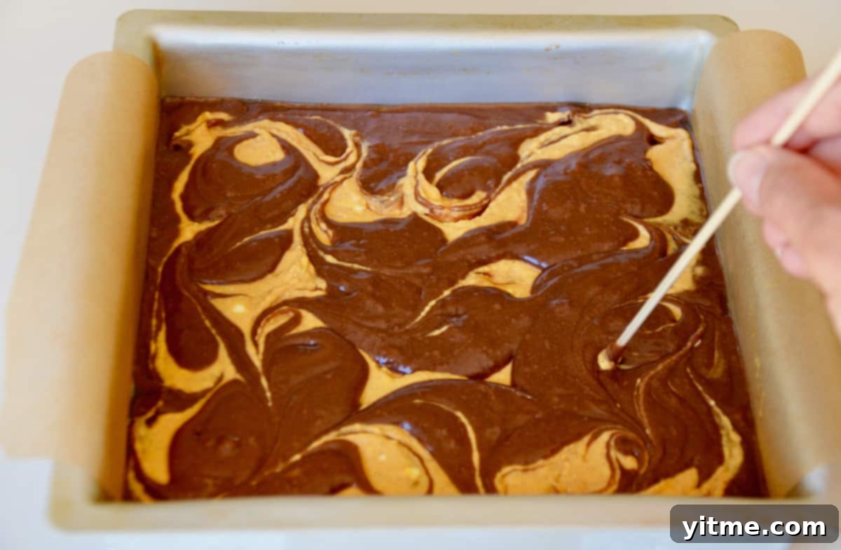 Close up of swirling batter in brownies.