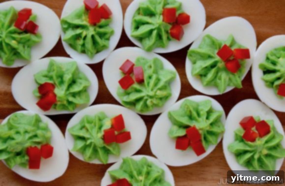 A wood platter with an overhead shot of Christmas Deviled Eggs