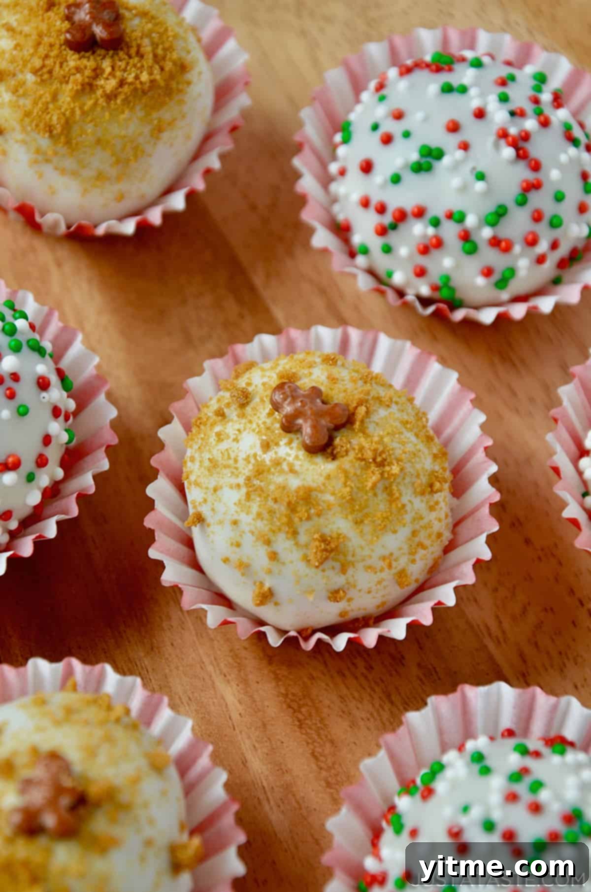 Chocolate- and sprinkle-covered gingerbread cookie balls in wrappers.