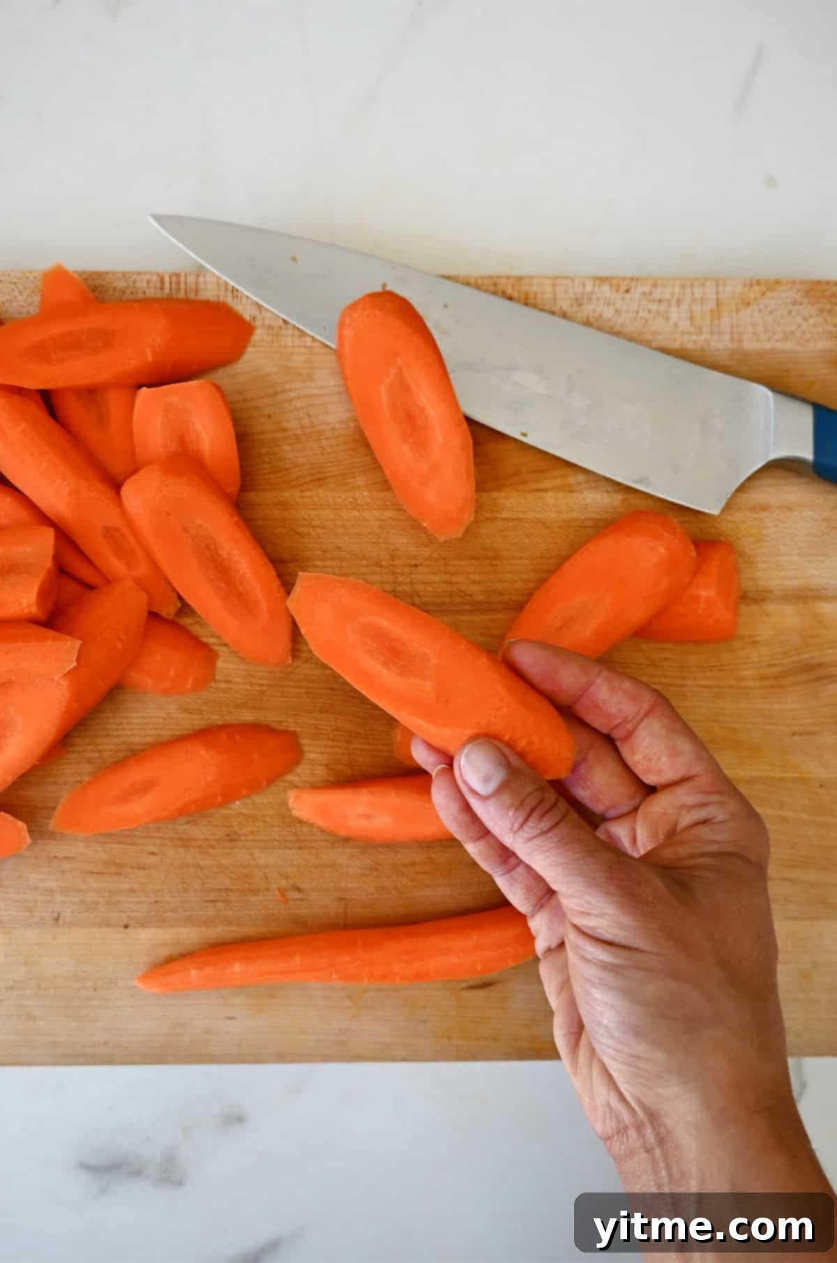 Honey-Glazed Roasted Carrots 5 Carrots cut on the bias, ready for roasting.