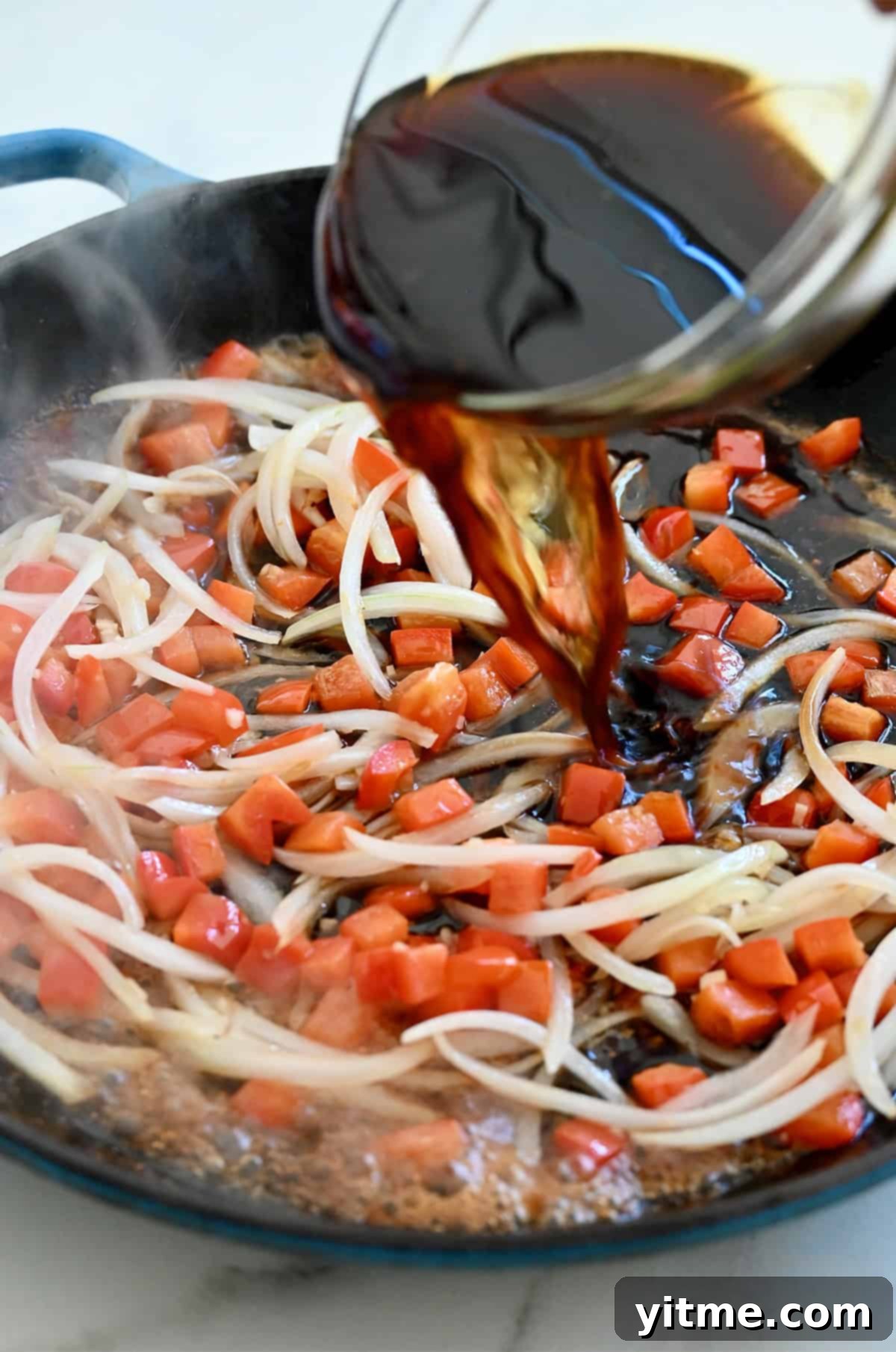 Adding black pepper sauce.