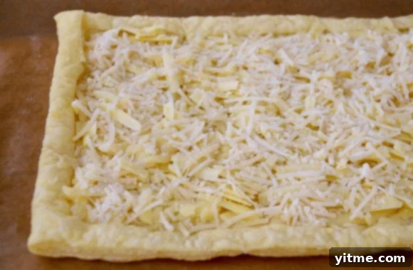 Close-up of Puff Pastry Tart with Gruyère and Parmesan Cheeses