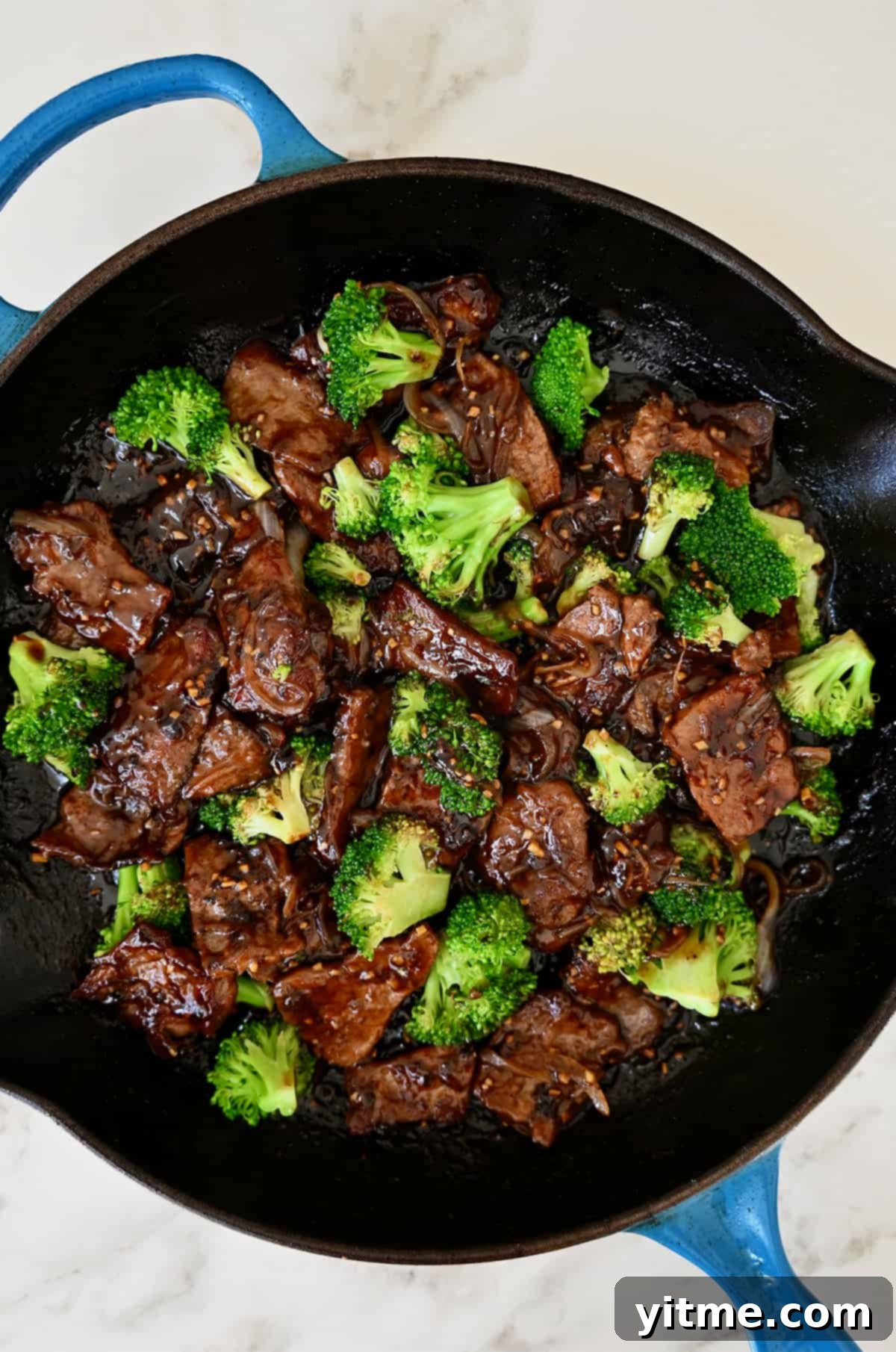 A delicious skillet of beef and broccoli in a garlicky soy sauce