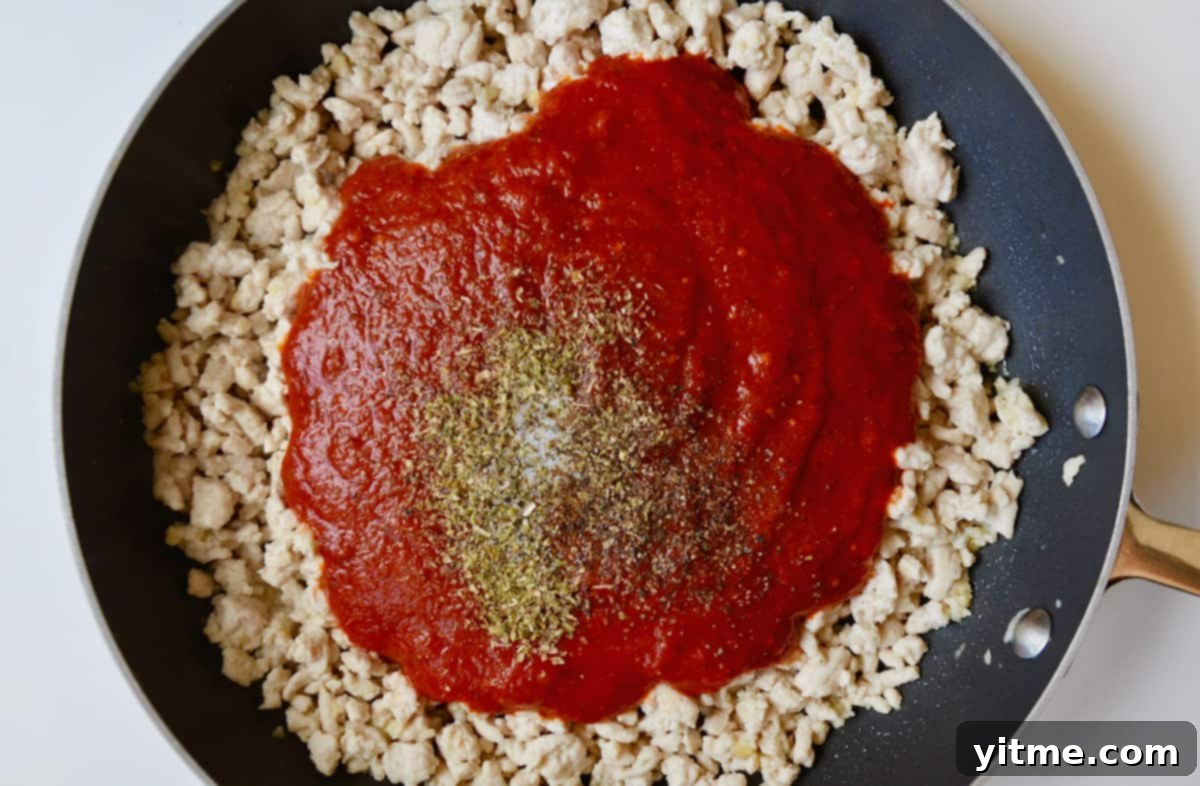 Turkey bolognese sauce simmering in a skillet
