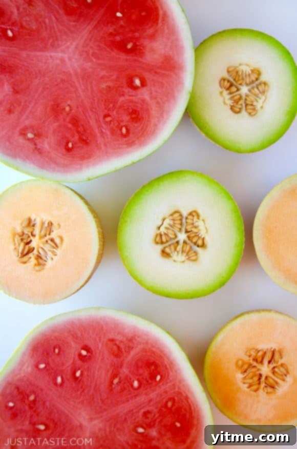 Watermelons, cantaloupes and honeydew melons cut in half