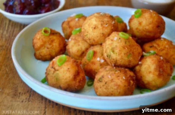 Plate of golden Leftover Mashed Potato Balls ready to be served.