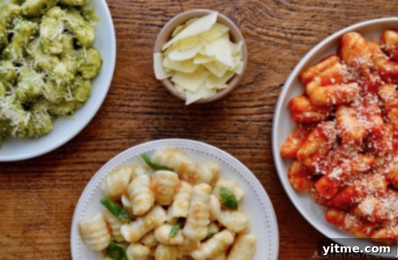 Repurposed Mashed Potato Gnocchi 6 A brown wood table with three plates of Mashed Potato Gnocchi