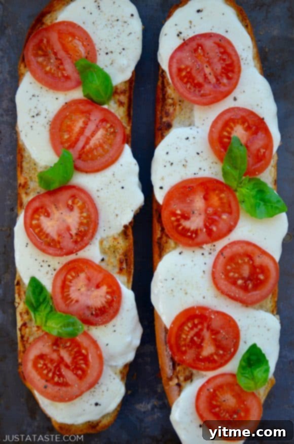 Fresh Caprese Garlic Bread 2 A top down view of two halves of Caprese Garlic Bread