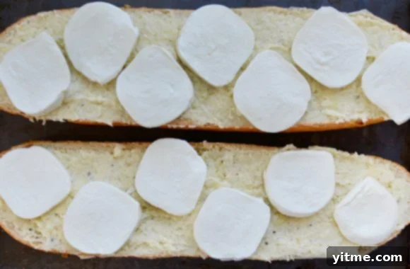 Fresh Caprese Garlic Bread 5 Two halves of bread with garlic butter and fresh mozzarella cheese