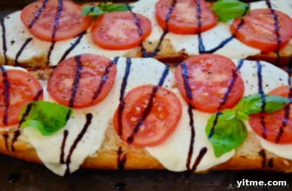 Fresh Caprese Garlic Bread 6 Two halves of Caprese Garlic Bread topped with mozzarella cheese, fresh tomatoes and basil, and drizzled with balsamic syrup