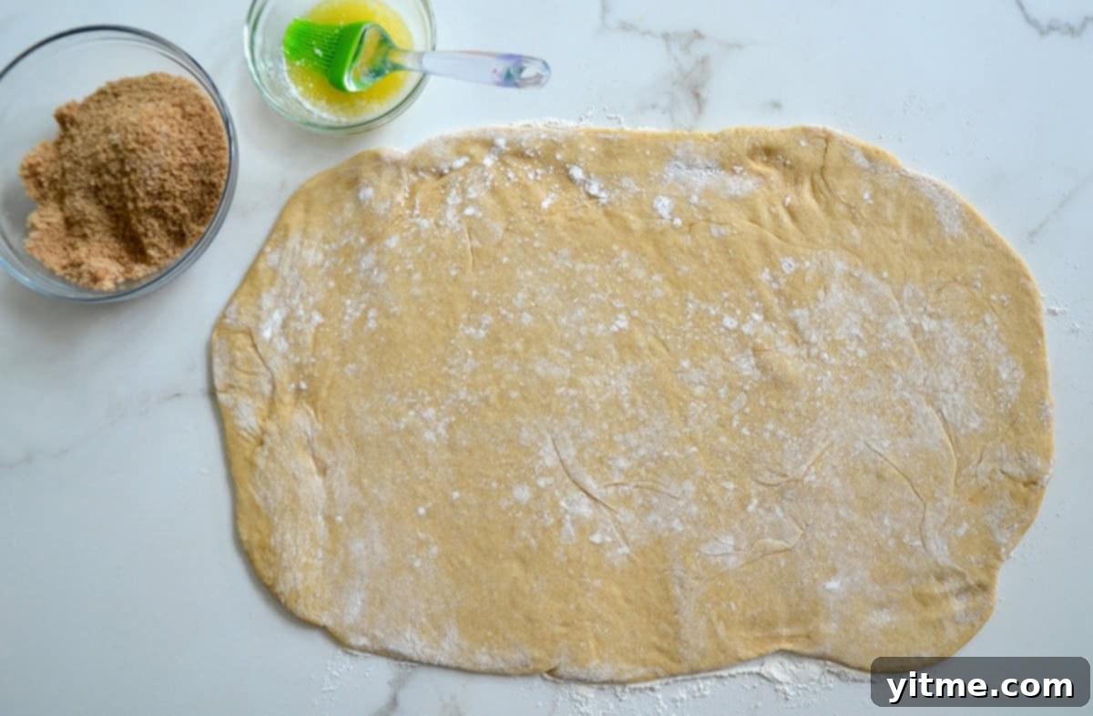 Rolling out cinnamon roll dough