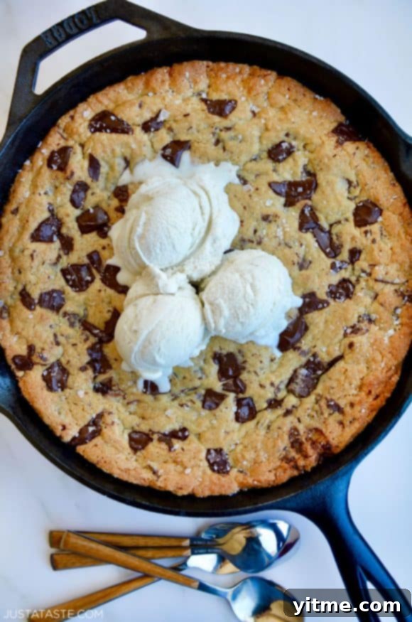 Top down view of The Ultimate Skillet Chocolate Chip Cookie topped with vanilla bean ice cream