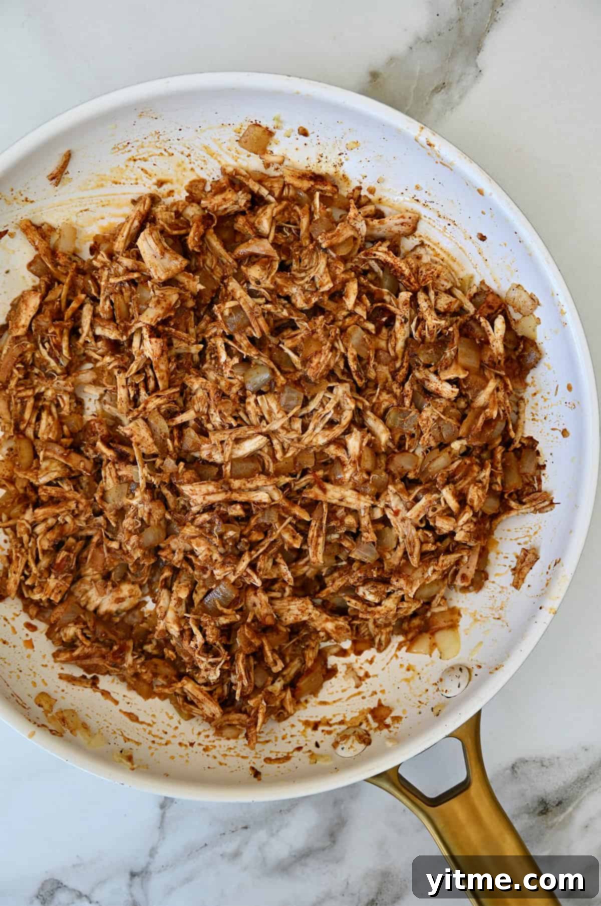 Weeknight Rotisserie Chicken Enchiladas 5 Chicken enchilada filling in a skillet.