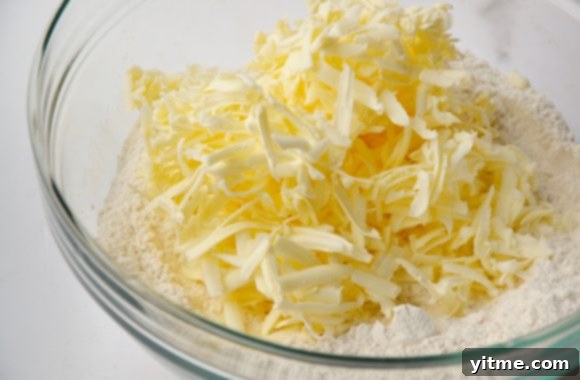 Clear bowl with grated butter and flour