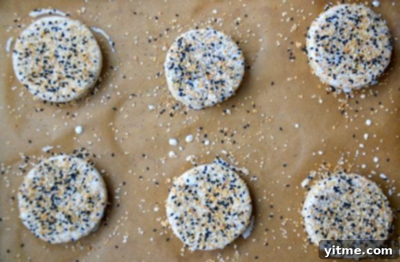 Biscuit rounds topped with everything seasoning