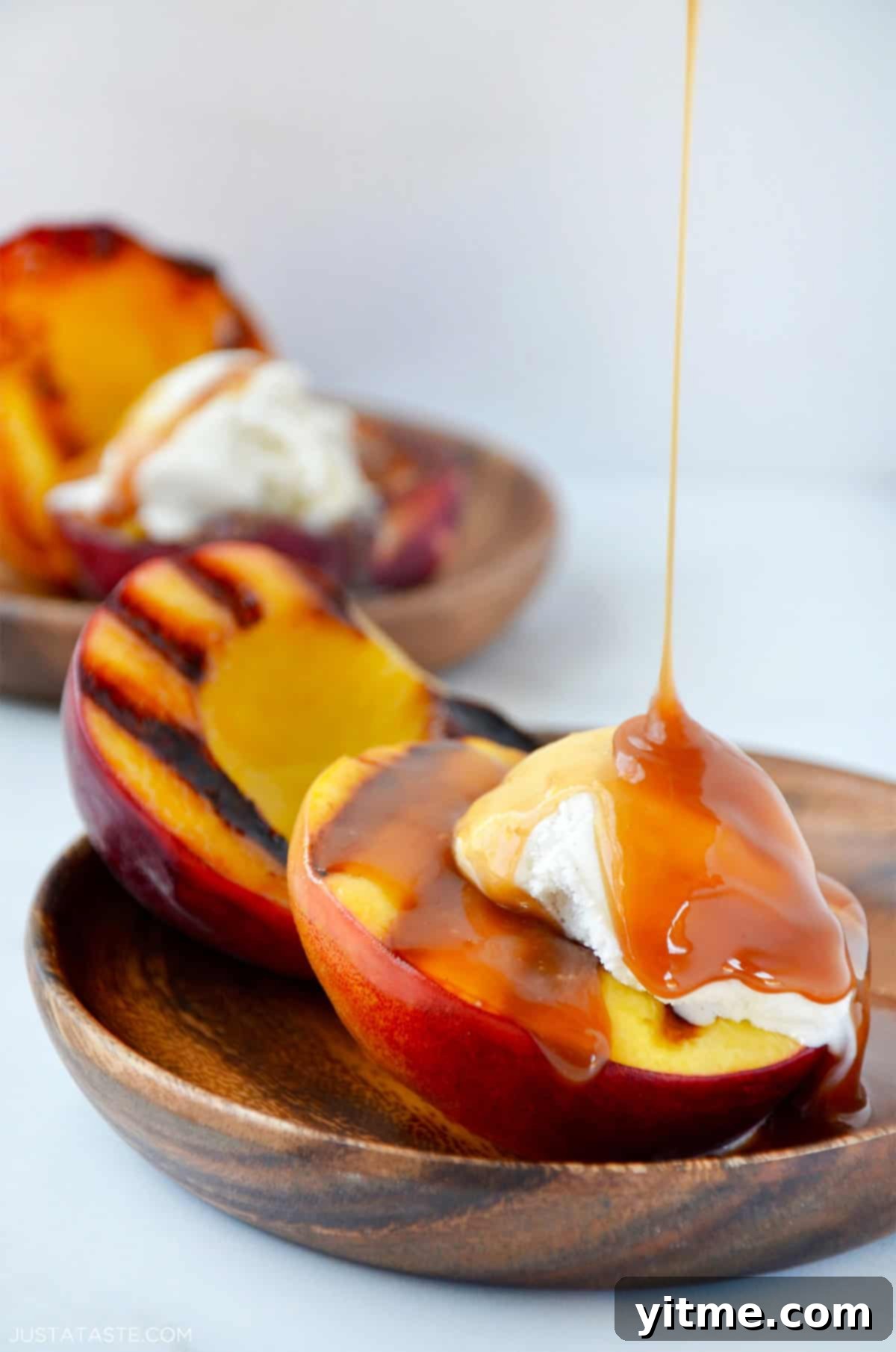 Grilled peaches with vanilla ice cream and bourbon caramel sauce.