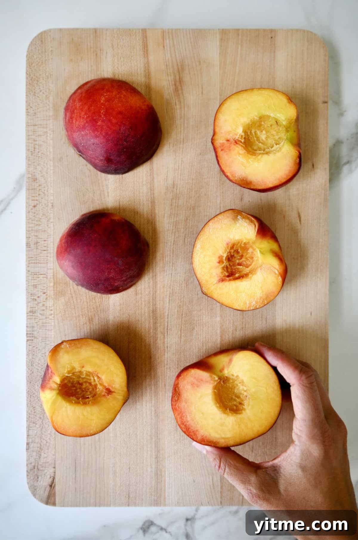 Halved peaches with pits removed.