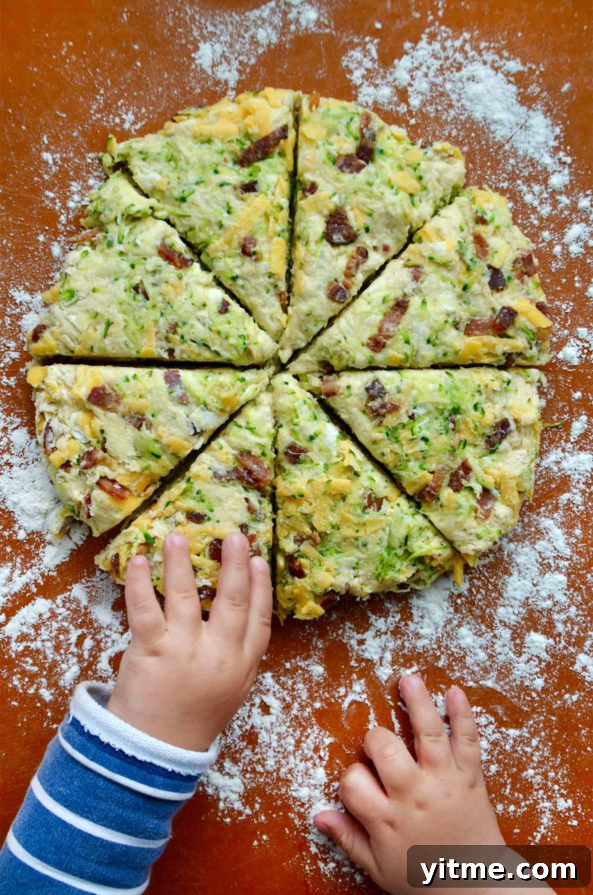 Child reaching for Zucchini Scone