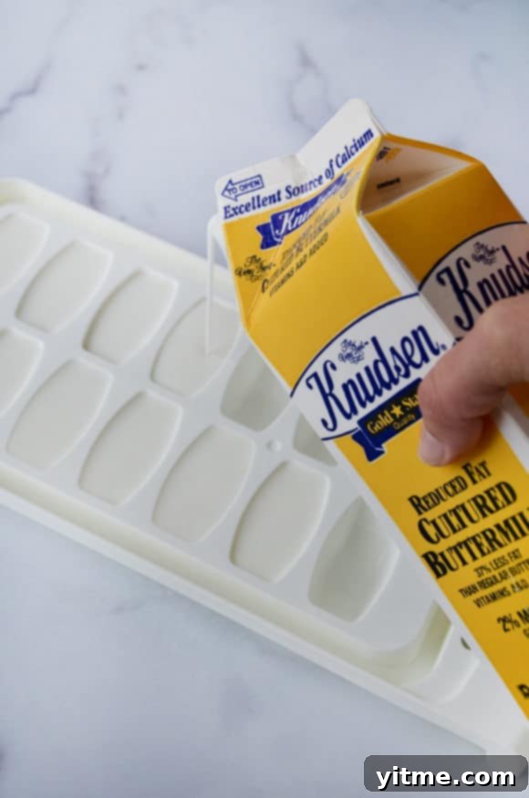 Top 5 Buttermilk Replacements 4 A carton of buttermilk being poured into an ice cube tray