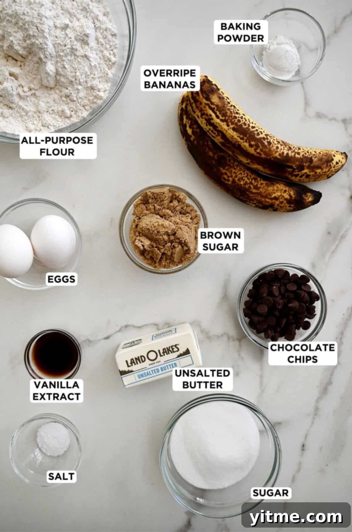 Ingredients for making banana chocolate chip cookies: ripe bananas, flour, sugar, butter, eggs, and chocolate chips.