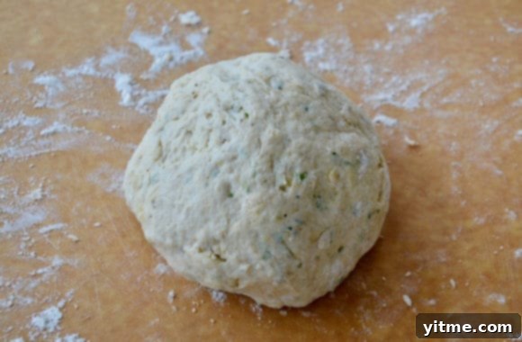 Ball of dough on flour-covered work surface 