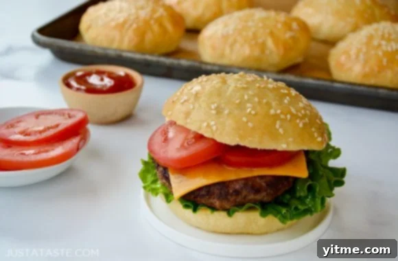 A no yeast burger bun with grilled hamburger, lettuce, tomato and cheese