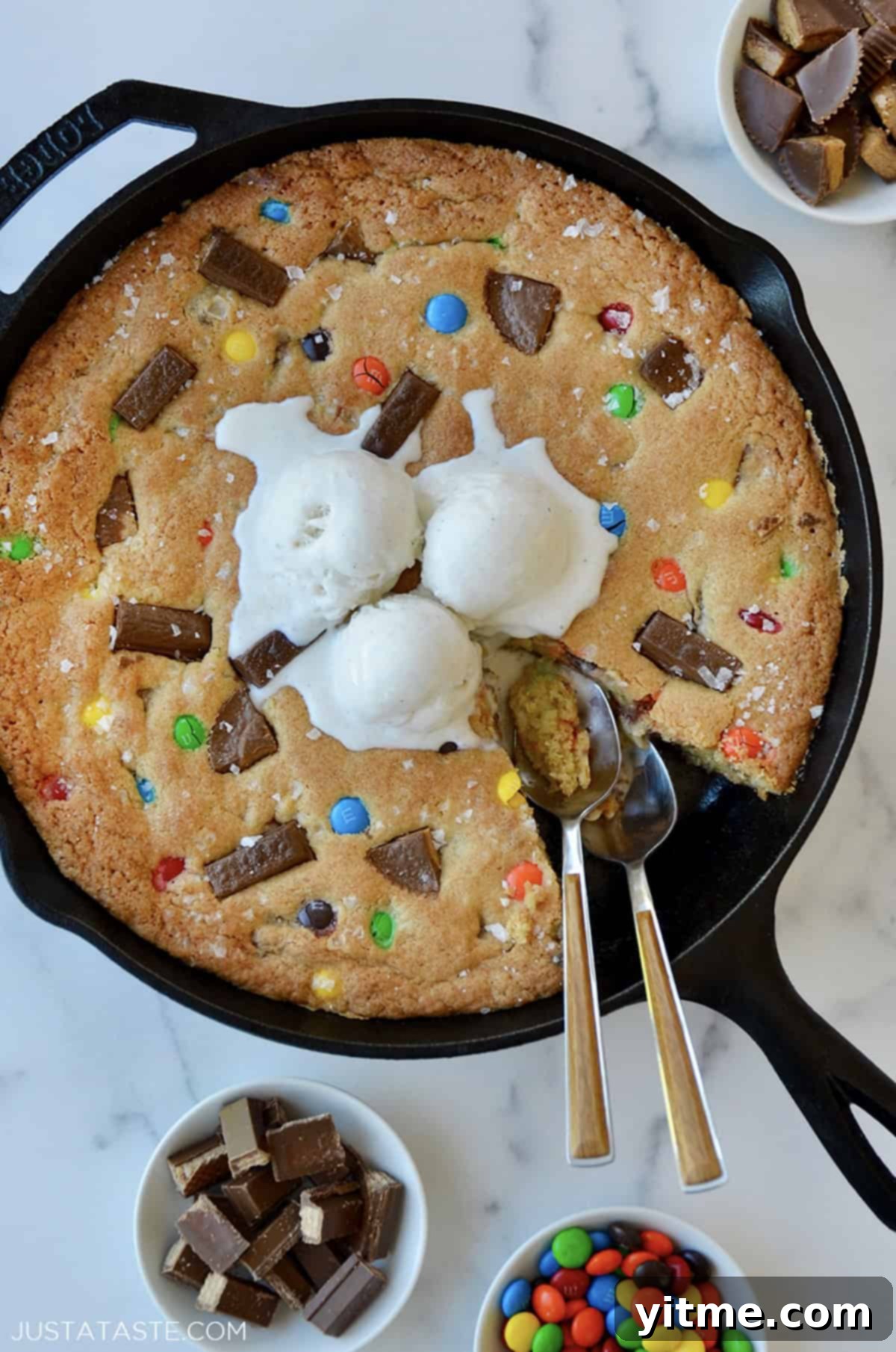 The best leftover Halloween Candy Skillet Cookie in a cast iron skillet.