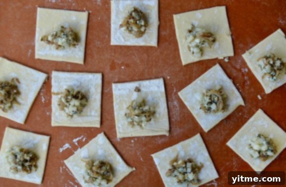 Puff pastry squares topped with caramelized onions and sliced fruit