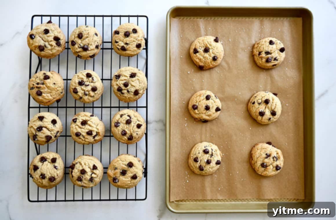 Cookies cooling on a wire rack beside a baking sheet