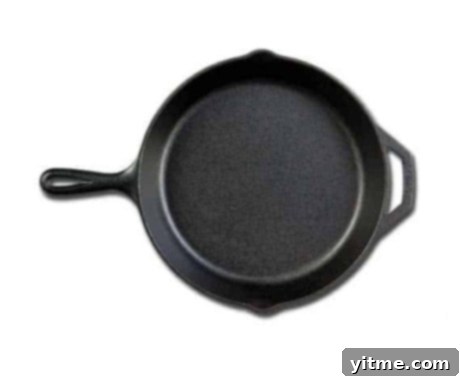 Flavorcast 6 A well-seasoned Lodge Cast Iron Skillet, showcasing its rugged, pre-seasoned surface, ideal for searing, frying, and baking, and offering exceptional heat retention and durability.