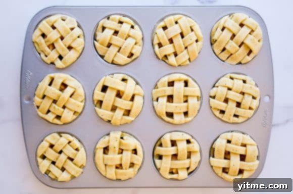Muffin tin apple pies topped with weaved pie dough