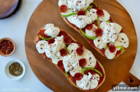 French Bread Pizza topped with burrata and pepperoni, showcasing the crispy crust and melted cheese.