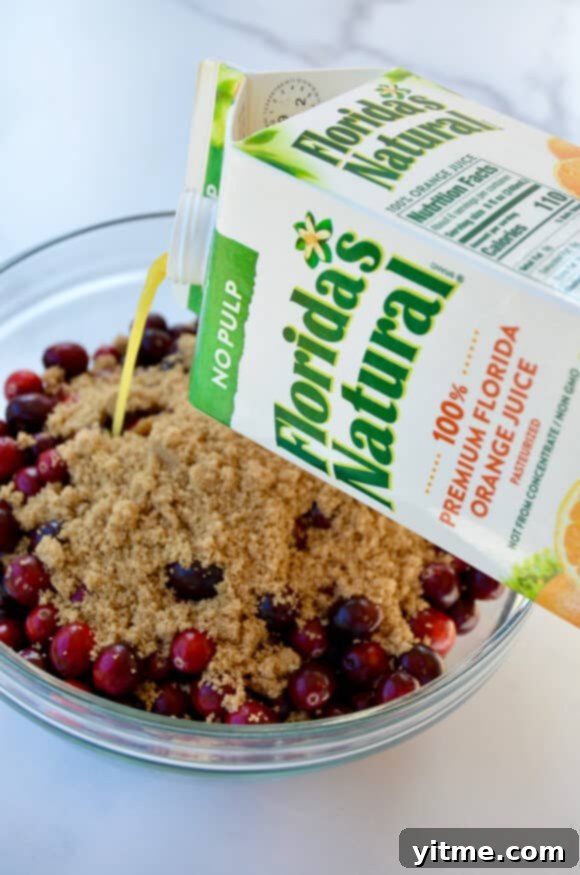 A carton of Florida's Natural Orange Juice being poured into a bowl