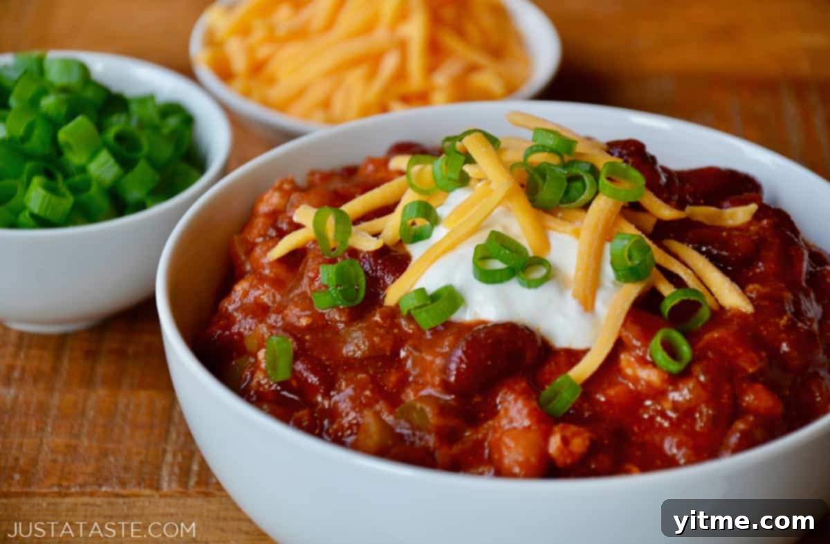 The finished turkey taco soup in a bowl, ready to be enjoyed with favorite toppings like sour cream, cheese, and scallions.