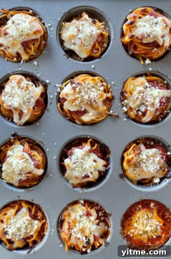 Cheesy Spaghetti Bites 4 A top-down view of spaghetti cupcakes in a muffin pan